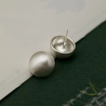 Detailed macro view of silver brushed metal ball earrings with professional pin structure - 925 Sterling Silver Pin Stud Earrings / Silver Stud Earrings