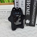Detail view of a black plush cat photo card holder with a transparent window and soft texture - New Black Cat