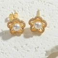Close-up of gold flower stud earrings with white pearl and sparkling cubic zirconia stones - Flower Pearl Stud Earrings (ES2367-2)