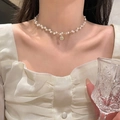 Elegant white pearl necklace with a vintage gold coin pendant on a female collarbone - Pearl Portrait Round Coin Pendant Necklace (X2803) / Gold