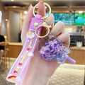 Purple unicorn liquid sand keychain with silicone strap and floating glitter charms - Flower Lollipop - Purple