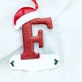 Christmas letter F resin ornament with red glitter finish and festive Santa hat - Letter F