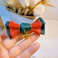 Detail of a red and green satin bow hair clip with gold edge and a small gold bell - Christmas Bow Series 10
