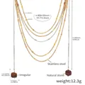 Detail of layered stainless steel chains with a faceted natural stone pendant - Gold Multi-Layer Red Tassel Necklace