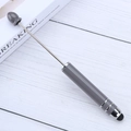 Sleek grey telescopic stylus and pointer pen for touchscreens shown on a desk - Bentley Grey