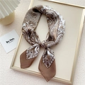 Brown and beige paisley print square silk scarf tied on a decorative golden tray - Camel Candle Flower