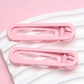 Minimalist 6cm pink U-shaped rectangle hair clips set on a decorative white wave board - Pink