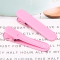 Detail shot of two pink seamless hair clips with a smooth matte finish on a clean background - 1.3x4.9cm / Deep Pink