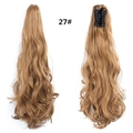 Macro view of model 27# long curly golden ponytail extension with a secure claw clip - Light Golden Brown