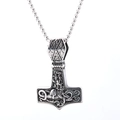 Detailed macro of vintage silver Thor's Hammer pendant with Nordic rune engravings - Animal Totem Relief Style (Style 1)