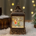 Vintage bronze Christmas lantern with LED glowing snow globe and festive tree scene - Child and Christmas Tree
