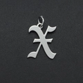 Macro view of a silver stainless steel hollow letter X pendant on a black textured surface - Letter X