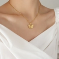Elegant gold butterfly necklace with zircon accents on a model wearing white V-neck - 40+5cm / Gold (P1215)