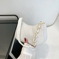 White corduroy crescent underarm bag with decorative acrylic and metal chain strap - White