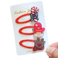 Detailed view of Christmas hair clip set featuring candy cane, glove, and reindeer motifs - 3-Piece Christmas Hair Clip Collection