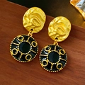 Vintage gold tone flower earrings with black base on rustic wooden background - Black Irregular Shape (18# Silver Pin)