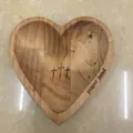 Handcrafted heart-shaped wooden prayer bowl with engraved crosses and natural wood grain finish - Brown Wood Heart Bowl