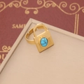 Macro detail of gold-plated lock ring featuring an oval blue turquoise stone inlay - 3# Ring