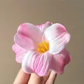 Pink and white tulip flower hair clip with yellow stamen held in hand - Pink Tulip
