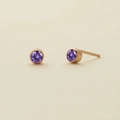 Minimalist gold plated stud earrings featuring round-cut purple zircon stones - February Violet - Gold