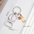 Detail view of beer bottle opener keychain with letter E, showing 8cm length dimensions - L