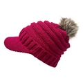 Detail showing knit texture and faux fur pompom on rose red peaked beanie - Rose Red