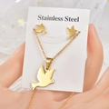 Detail view of a gold stainless steel peace dove necklace and earrings jewelry set - TT-071 (Peace Dove)