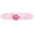 Bracciale di perle in quarzo rosa con ciondolo a tartaruga su sfondo bianco pulito - Quarzo rosa