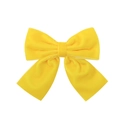 Detail shot of bright yellow velvet handmade bow hair clip with premium smooth texture - Yellow