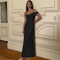 Detail of elegant black dress showing side ruching and asymmetrical shoulder straps - S / Black