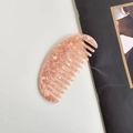 Pink marble acetate wide-tooth hair comb with half-moon shape on white background - Peach Oval