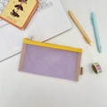 Close-up of a purple mesh pencil case with yellow zipper on a minimalist white desk - Light Purple