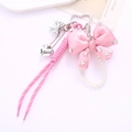 Detail of pink satin bow keychain with rhinestone embellishment and pearl chain - Braided Rope + Rhinestone Bow Pendant Pink (K4544)