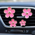 Pink daisy flower car air vent perfume clips in gold trim set on car dashboard - 4pcs Set + Fragrance Tablet / Pink