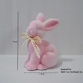 Pink flocked Easter rabbit figurine with raffia bow, size 19cm height and 14cm length - Pink (Height 19cm)