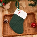 Green knit Christmas stocking with red letter I embroidery and cream cuff detail - Letter I