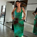 Detail of green floral print two-piece set featuring halter neck top and slim maxi skirt - S / Green