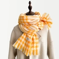 Yellow and white houndstooth tassel scarf in soft cashmere-like fabric on a model - Yellow Style (Style 3)
