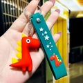 Simpatico portachiavi a forma di dinosauro rosso in silicone con cinturino da polso - Rosso