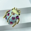 Macro shot of beetle brooch with light blue enamel wings and rose red rhinestones on white - Style 3-Light Blue Enamel Pink Stone Beetle