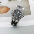 Detail of grey steel quartz watch with black dial and bold numerals on magazine background - Style C Black Case Black Band Black Dial