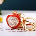 Sparkling lychee fruit keychain with red rhinestones and gold metal lobster clasp - Single OPP Bag Packaging / Full Rhinestone Lychee