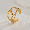 Close-up of golden irregular hollow ring showing wide band and polished metallic texture - Gold Irregular Three Holes (R733-B)