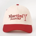 Close-up of Martini Social Club embroidery on a cream and red cotton baseball cap - Beige and Red