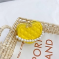 Bright yellow heart-shaped quilted mini bag with pearl handle and gold chain strap - Yellow