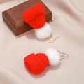 Detailed close-up of handmade red knitted Christmas hat earrings with soft white pom-poms - Christmas Hat Knit Style