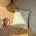 Close-up of yellow nylon storage pouch with purple ring zipper on a cozy wooden floor - Vertical 16x18cm / Lemon Yellow (Vertical)