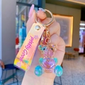 Crystal geometric bear keychain with purple heart and colorful laser wrist strap - Yellow