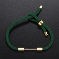 Detail of dark green braided rope bracelet with adjustable gold slide buckle and metal bars - Dark Green