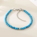 Détail macro de perles texturées bleu ciel avec fermoir mousqueton et pendentif cœur - Couleur Acier Style Turquoise Bleue (KB207124-Z)